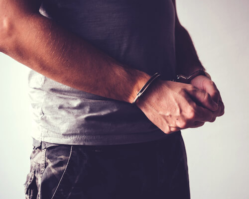 Man In Hand Cuffs Photo